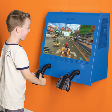 A boy playing games on the Euro Metal game cabinet.