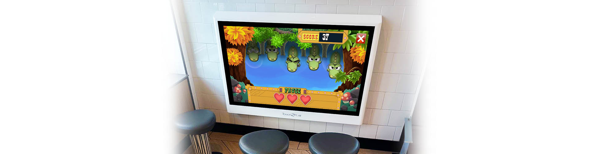 The Touch2Play Toddler Play Wall installed in a McDonald's restaurant.