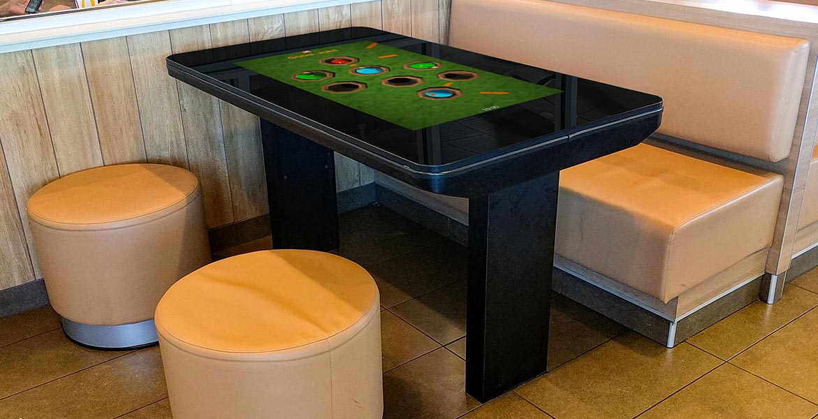 Touchscreen tabletop game Kidzpace Interactive Play Table the Family Entertainment Table installed in a McDonald's restaurant