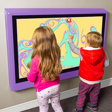 Children play touchscreen games together on the Touch2Play Junior Wall interactive play wall.