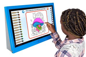 A young girl playing a painting game on the Touch2Play Max
